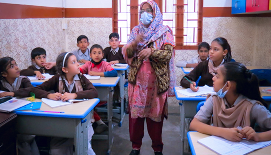 Teacher helping students